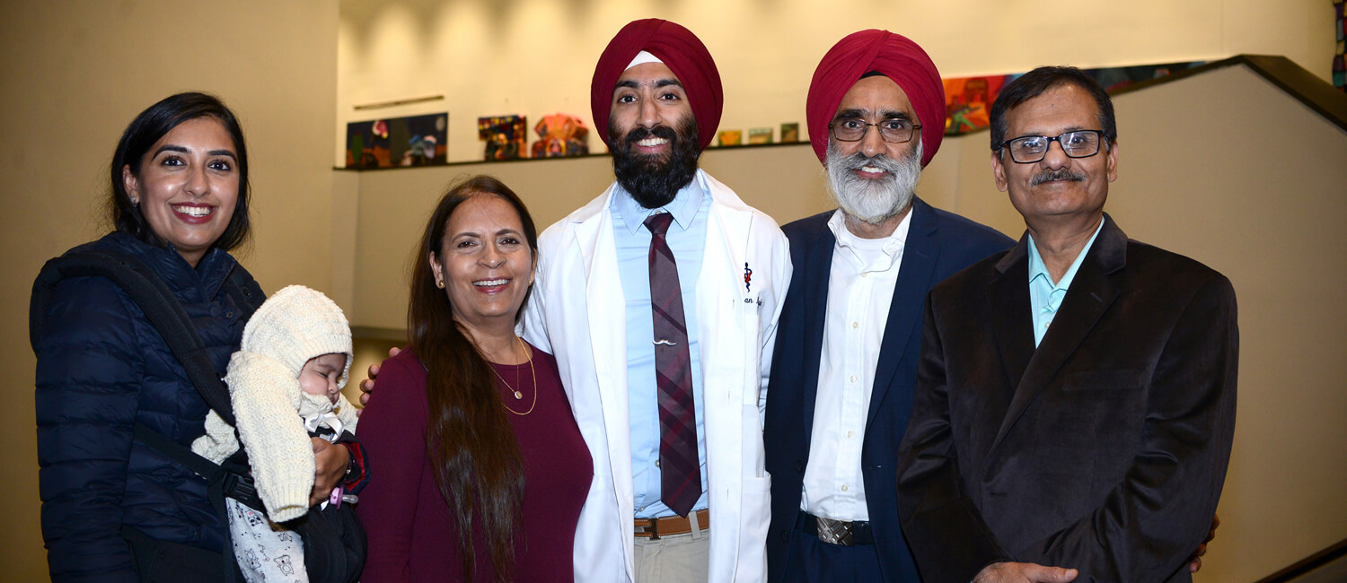 People standing together after a white coat ceremony