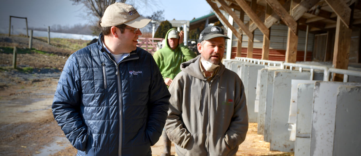 Dr. Joe Bender visits a dairy farm client.