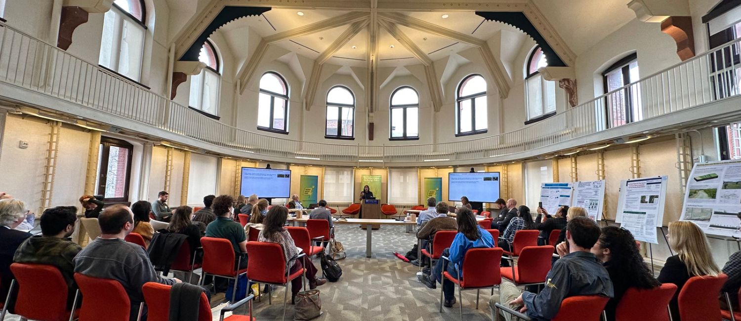 People sitting in a room listening to a lecture